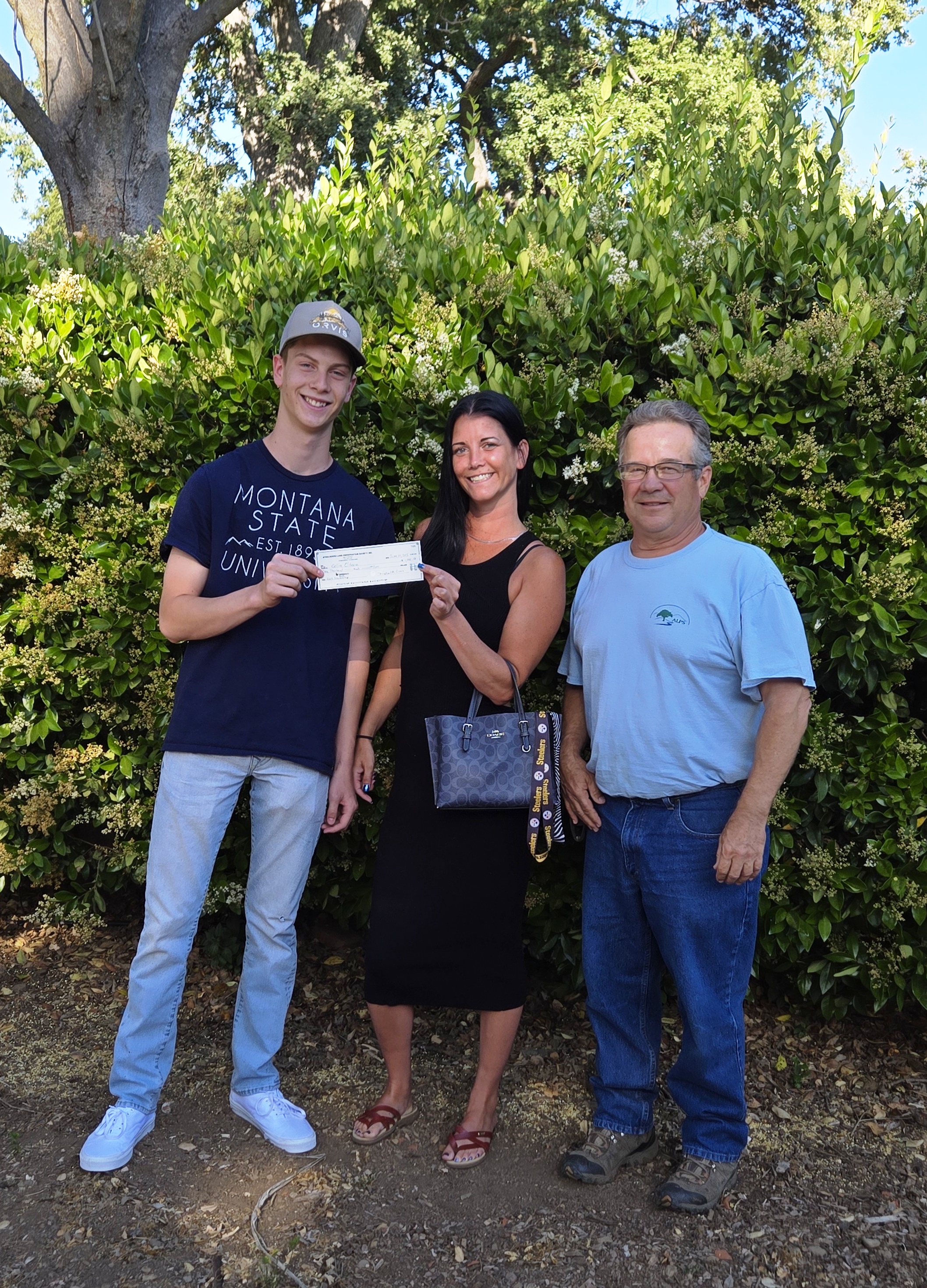 Colin and his proud Mother hold the check.